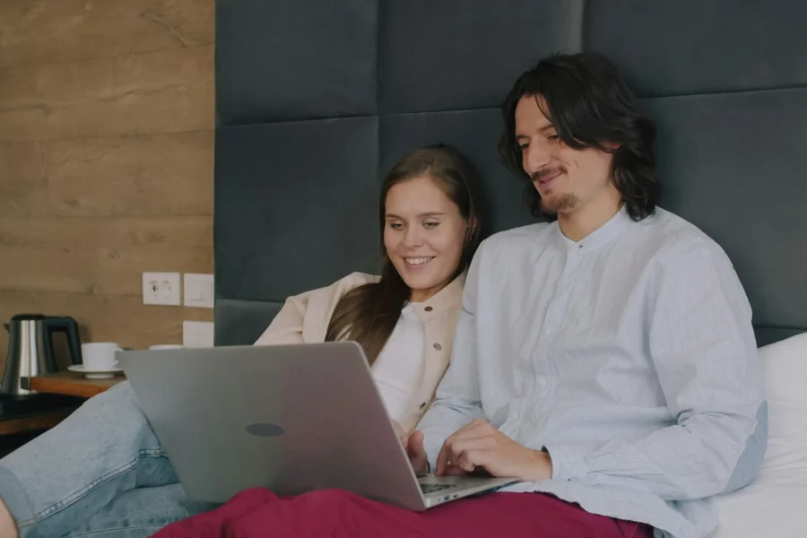 Couple watching something together on a laptop