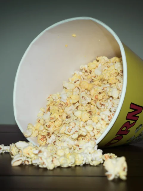 Popcorn spilling from a bowl